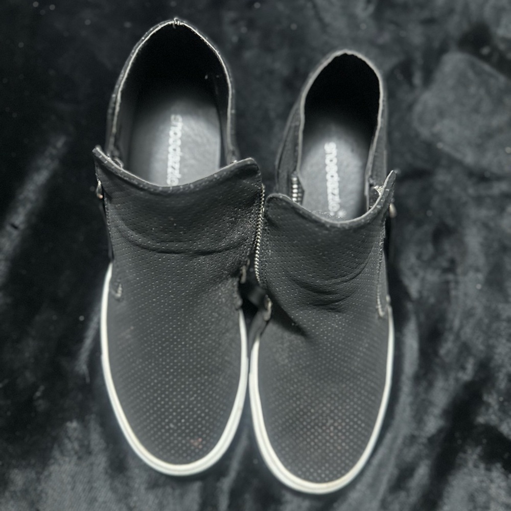 Size 8 black healed shoe.